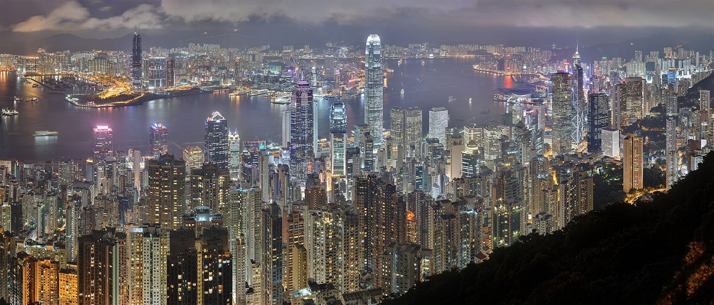 Hong Kong at night from Lugard Road on Victoria Peak: the lit-up towers of Hong Kong Island, Victoria Harbour and Kowloon beyond
