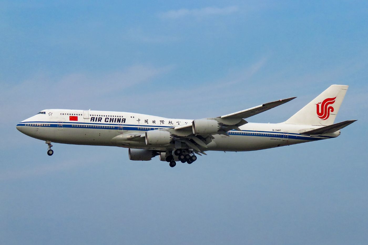 An Air China Boeing 747 with its landing gear down on approach to Beijing Capital airport