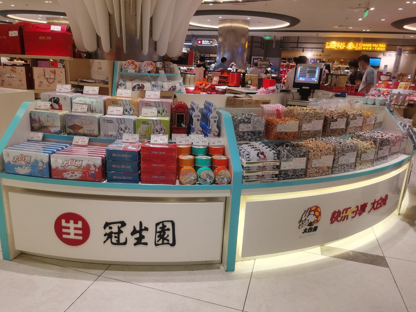 A stand of White Rabbit sweets in different flavours in decorative tins in a Shanghai mall